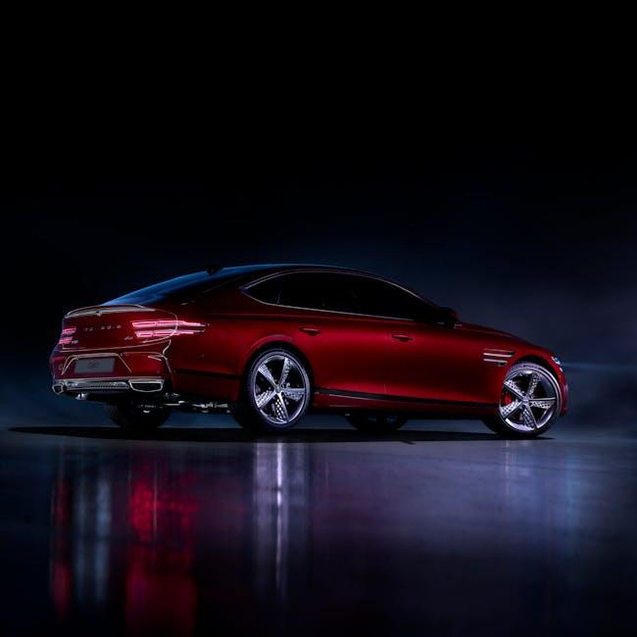 Prestazioni_e_tecnologia_del_Genesis_GV60_Magma_1glPerkGaT - Veicoli24 Source: Hyundai Motor Group - pexels - A stylish red luxury car displayed in a dramatic nighttime setting, showcasing its sleek design.